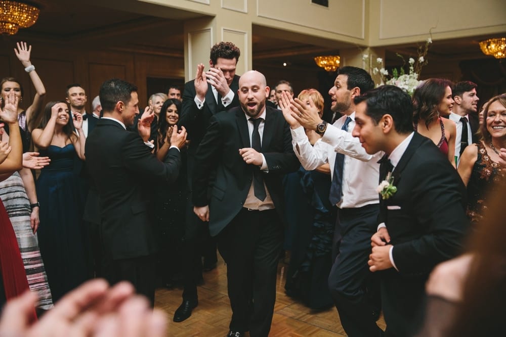 A documentary photograph of wedding guests dancing during a Taj Boston Hotel Wedding in Massachusetts
