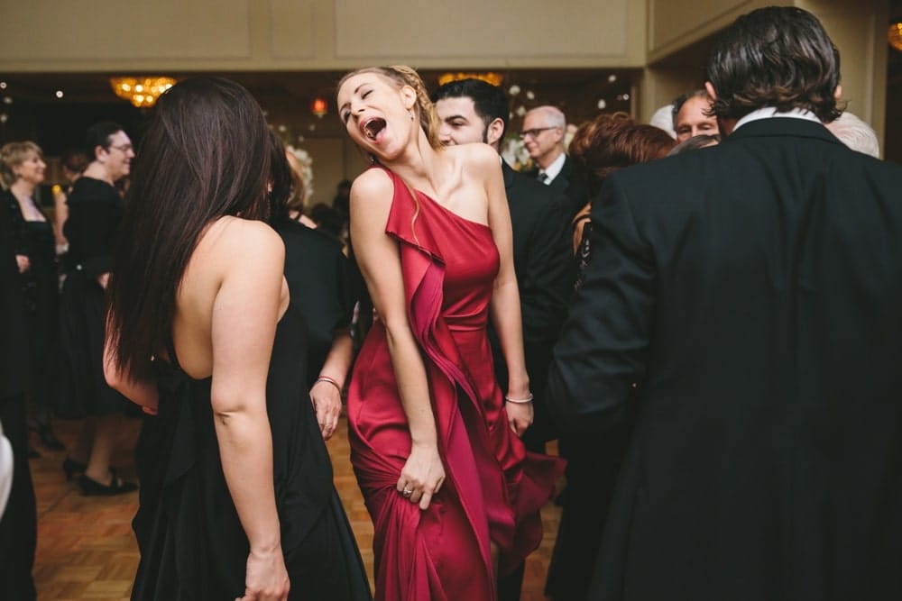 A documentary photograph of a wedding guests dancing during a Taj Boston Hotel Wedding in Massachusetts