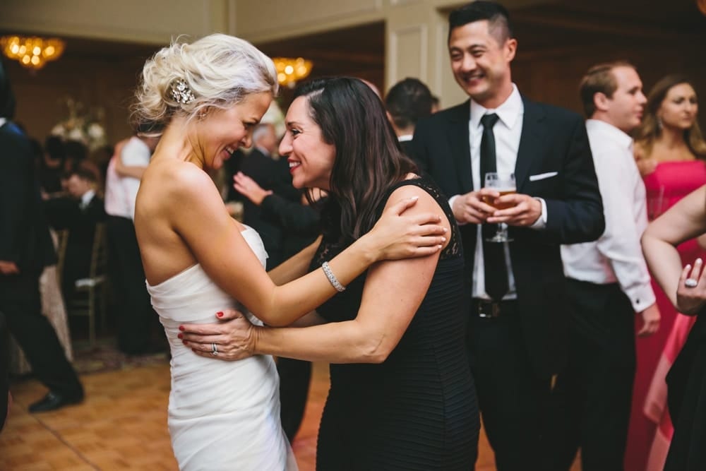 A documentary photograph of a bride and her friend on the dance floor during a Taj Boston Hotel Wedding in Massachusetts