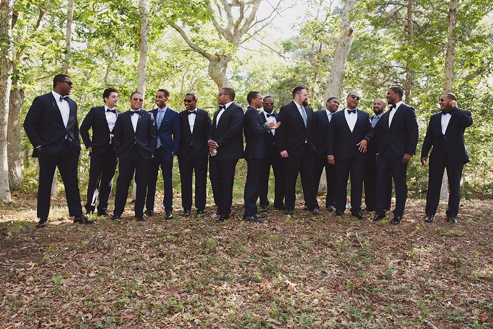 A documentary photograph of Groomsmen talking before a Martha's Vineyard Wedding