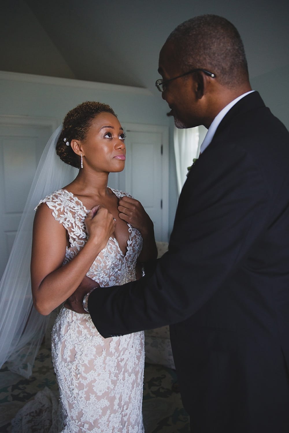 A documentary photograph of a bride sharing a special moment with her father before the walk down the aisle at her Martha's Vineyard Wedding