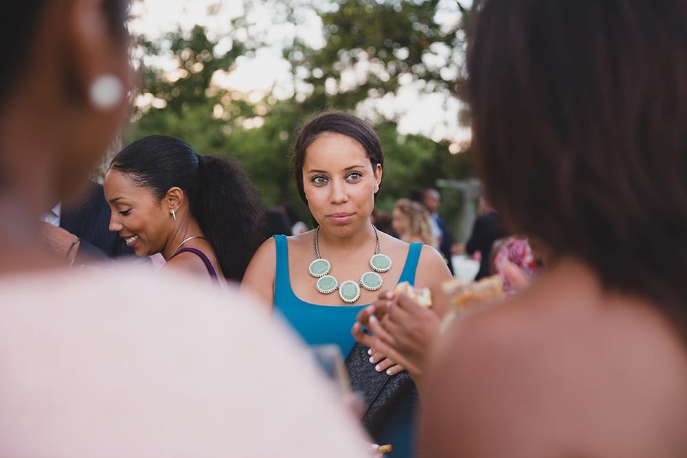 A documentary photograph of guest talking during the cocktail hour of a Martha's Vineyard Wedding
