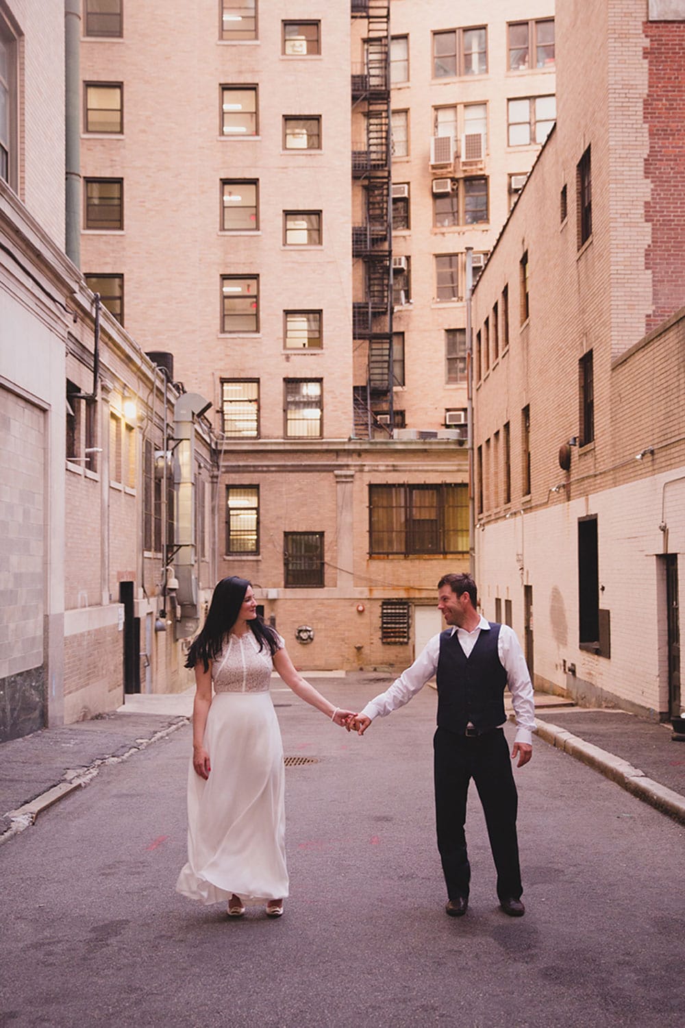 A relaxed portrait of a couple in an alley during their Boston Engagement Session