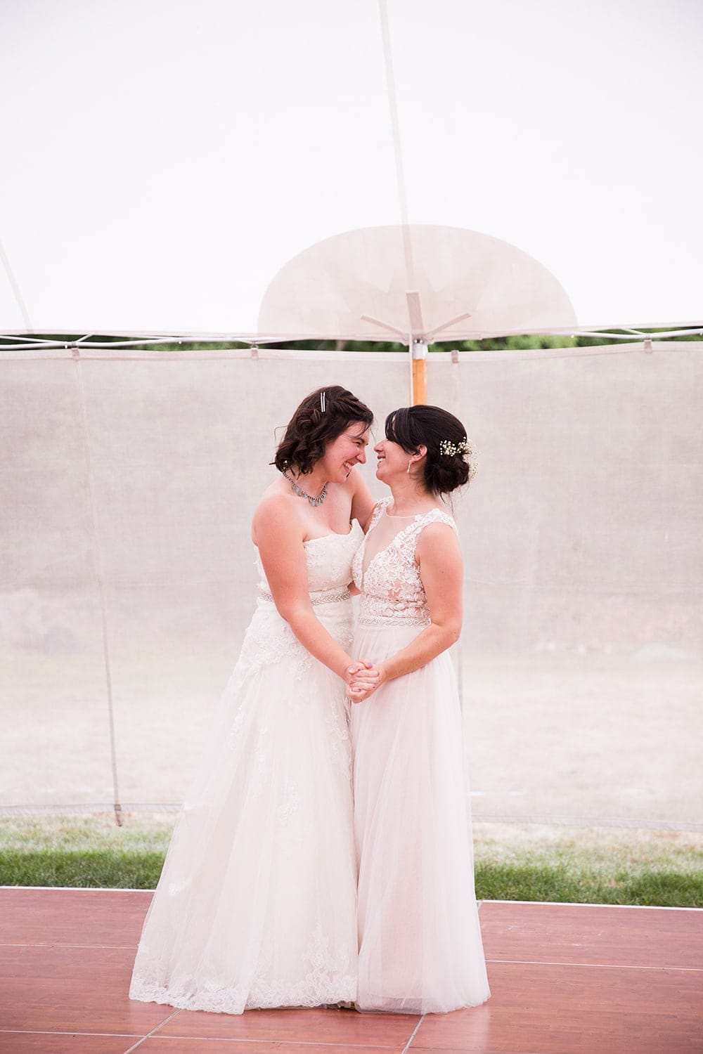 A documentary photograph of two brides having their first dance at their Friendly Crossways Wedding