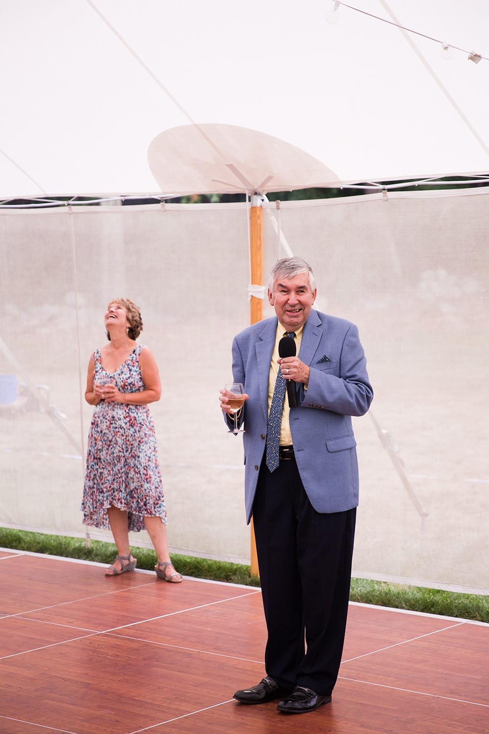 A documentary photograph of the father of the bride giving a toast at a Friendly Crossways Wedding
