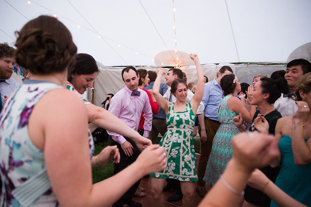 A documentary photograph of guests dancing at a Friendly Crossways Wedding