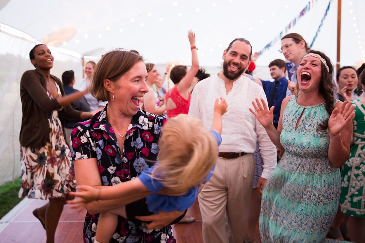 A documentary photograph of guests dancing at a Friendly Crossways Wedding