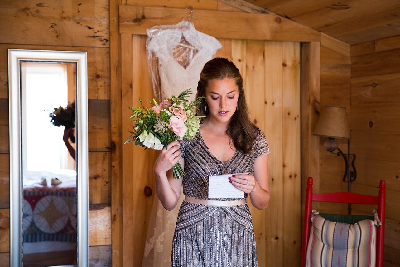 A documentary photograph of the maid of honor practicing her speech before a Kingsley Pines Camp Wedding in Maine