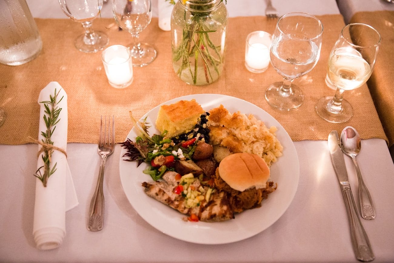 A detailed photograph of the bride's dinner at her Kingsley Pines Camp Wedding in Maine