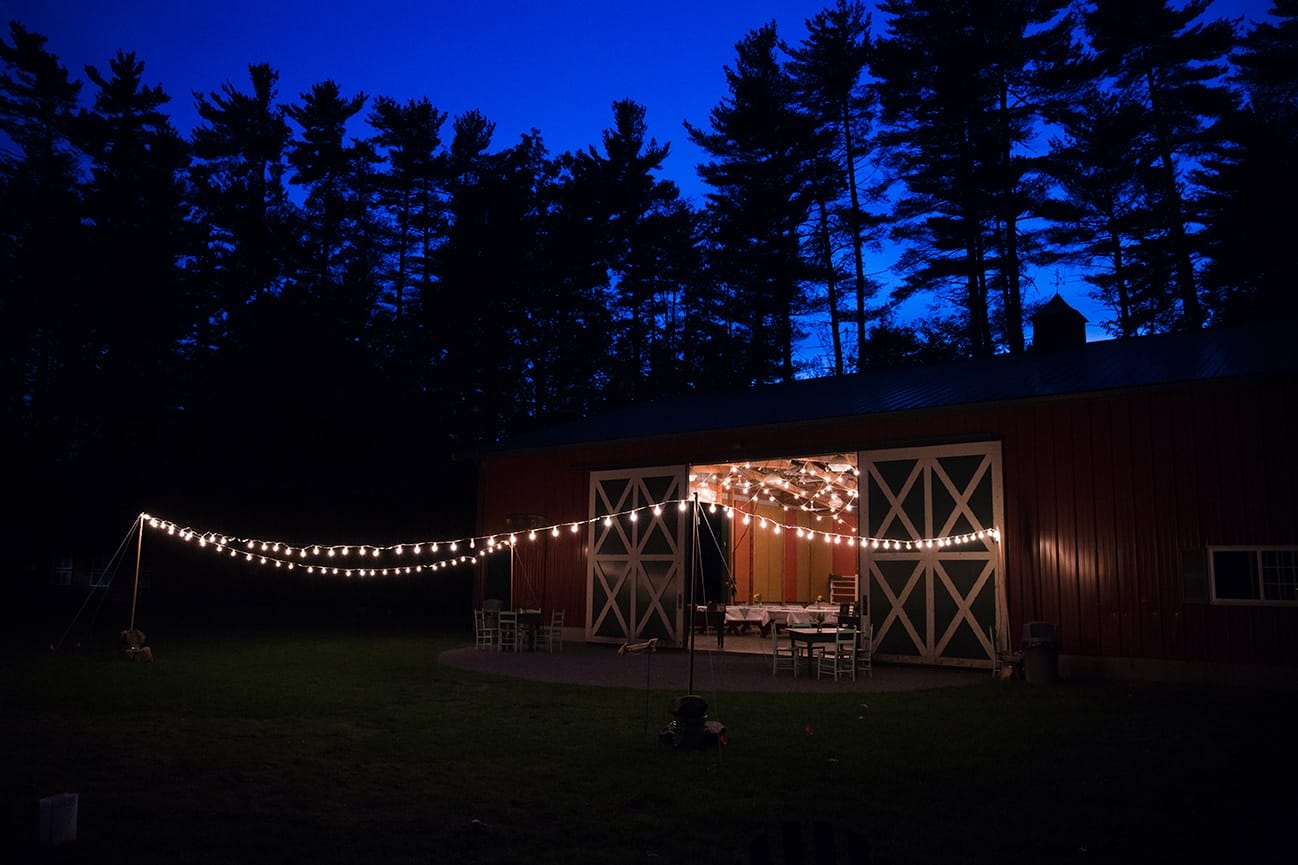 An artistic photograph of the barn at Kingsley Pines Camp during a wedding reception in Maine