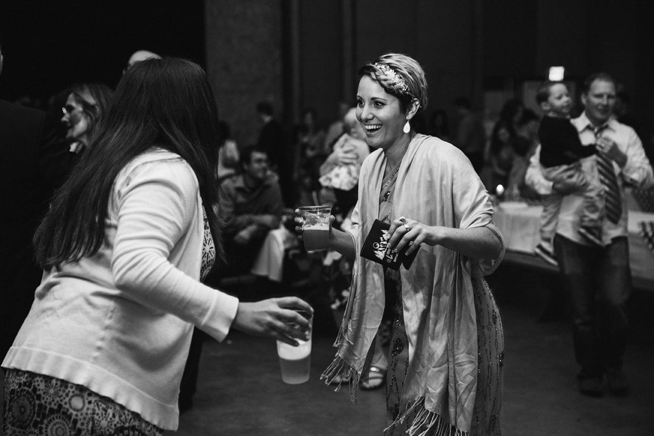 A documentary photograph of guests dancing at a Kingsley Pines Camp Wedding in Maine