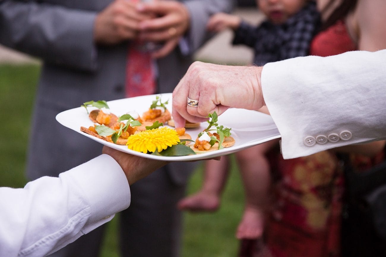 A documentary photograph of guests during the cocktail hour of a Lyman Estate Wedding in Boston, Massachusetts
