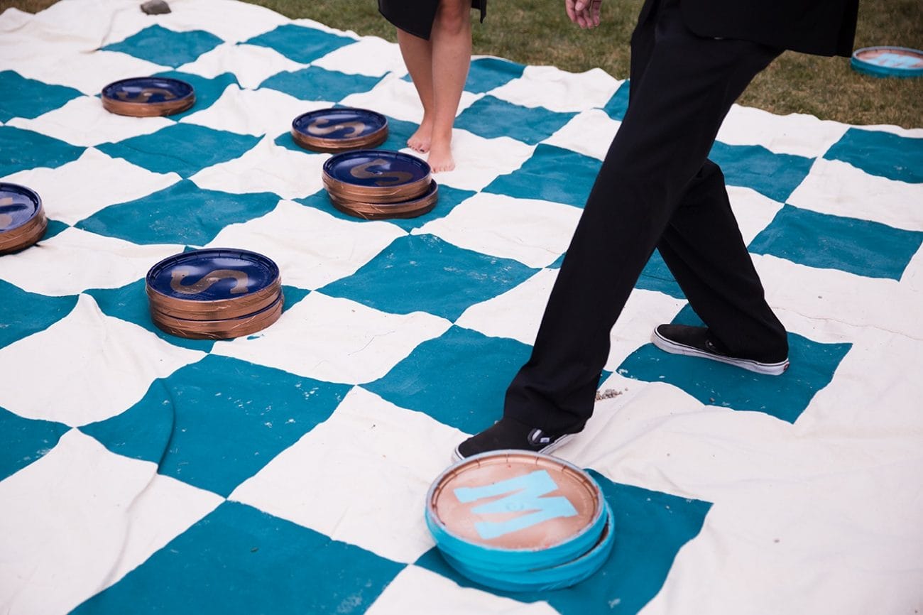 A documentary photograph of guests playing lawn games during cocktail hour at a Lyman Estate Wedding in Boston, Massachusetts
