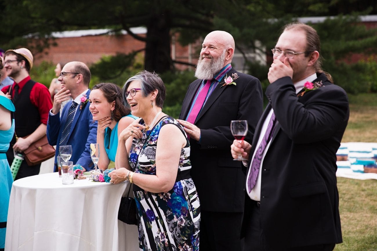 A documentary photograph of guests laughing during the maid of honour speech at a Lyman Estate Wedding in Boston, Massachusetts