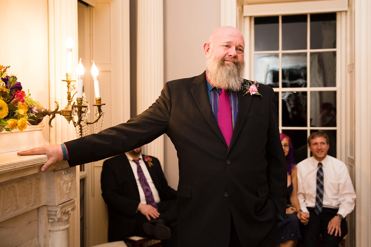 A documentary photograph of the father of the bride watching his daughter during her Lyman Estate Wedding in Boston, Massachusetts