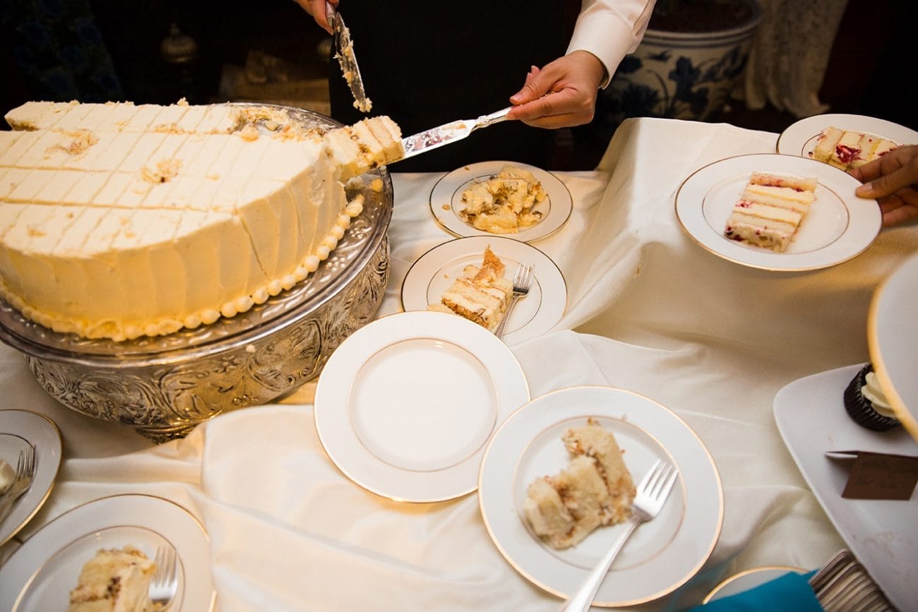 A documentary photograph of cake being served at a Lyman Estate Wedding in Boston, Massachusetts