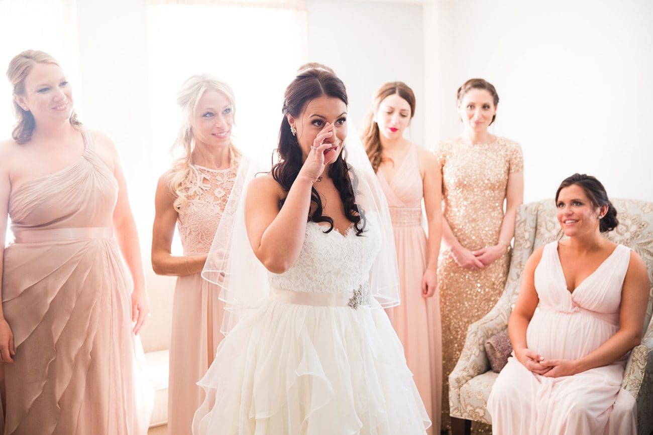 This documentary photographs of a bride looking in the mirror before her ceremony is one of the best wedding photographs of 2016