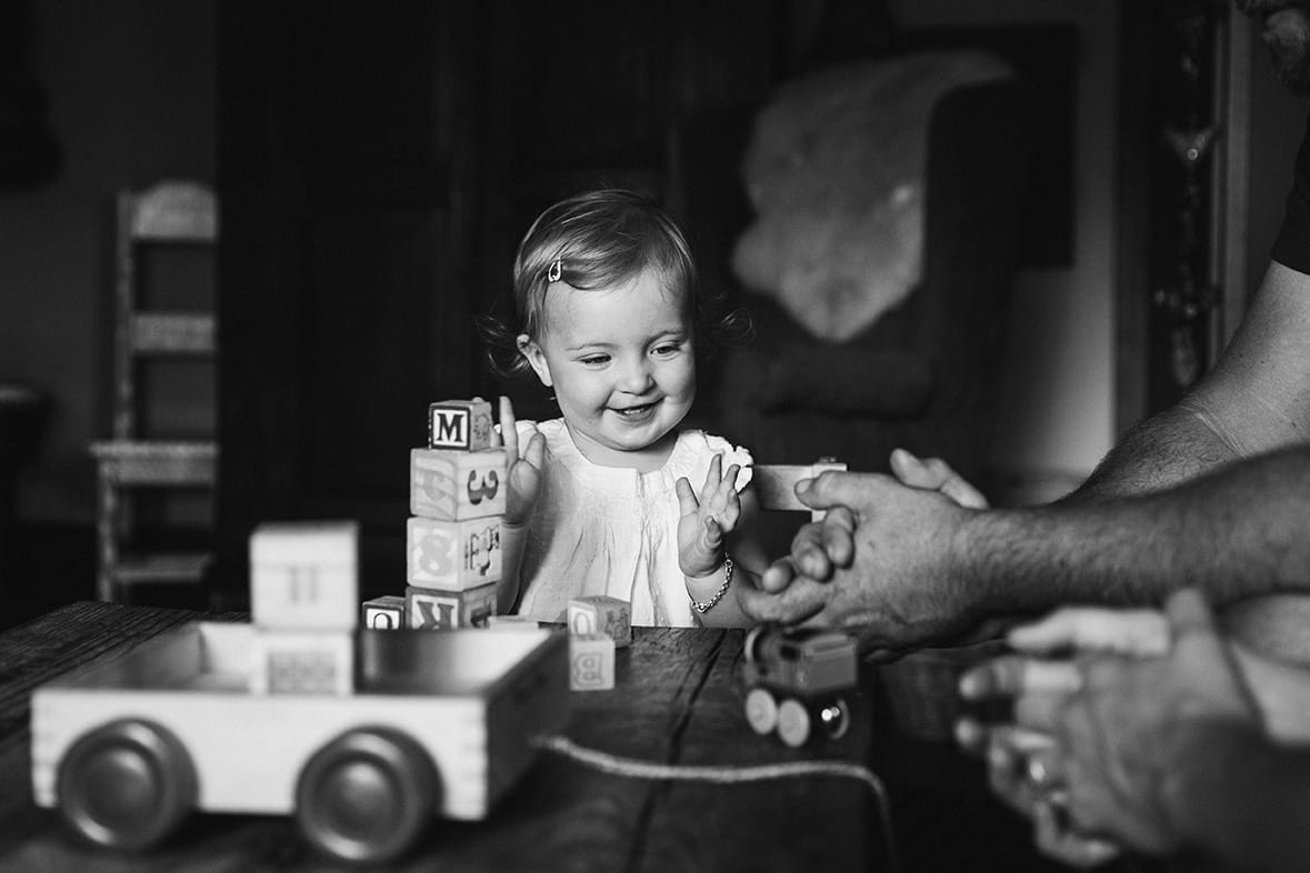 This documentary photograph of a toddler playing with her toys at home is one of the best family photographs of 2016
