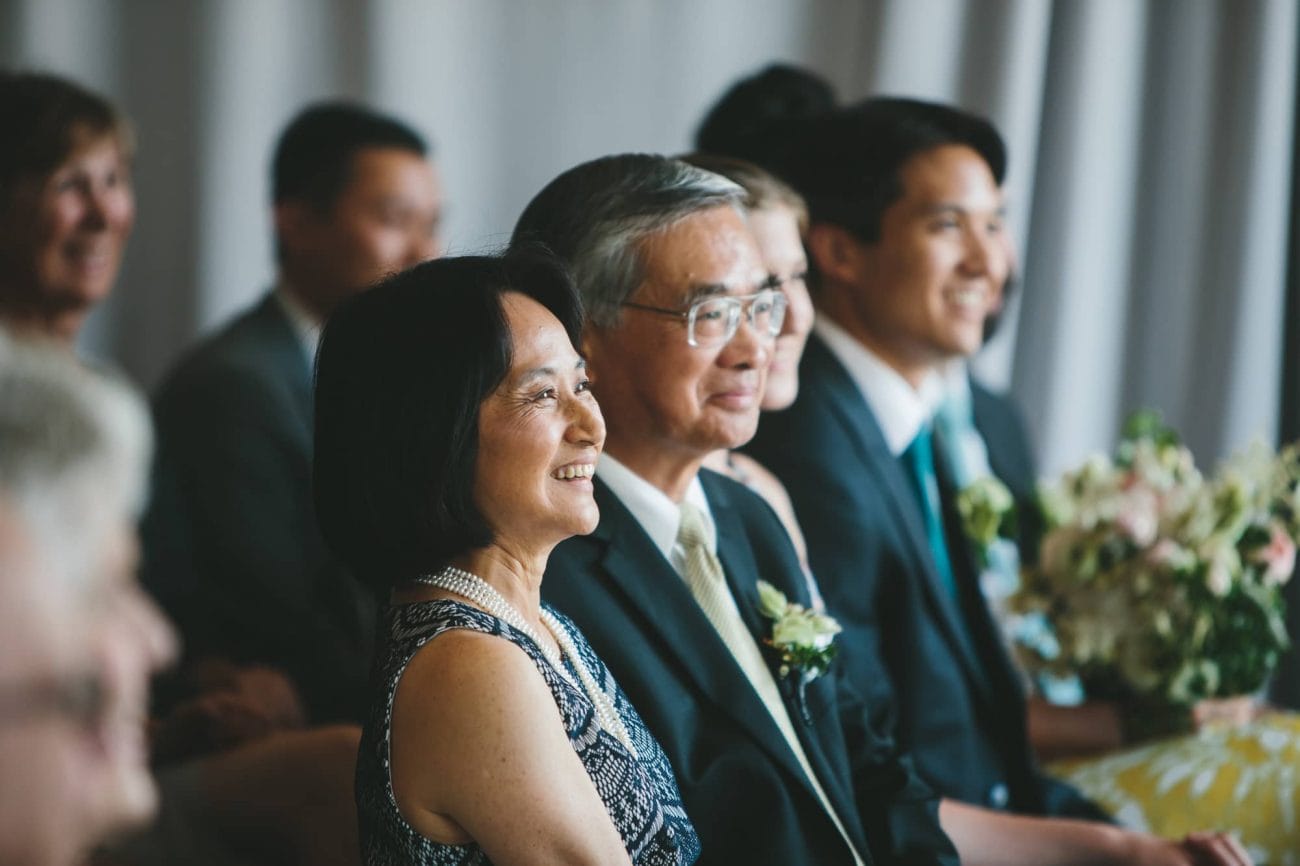 This documentary photograph of a groom's parents during an Artists for Humanity wedding is one of the best wedding photographs of 2016