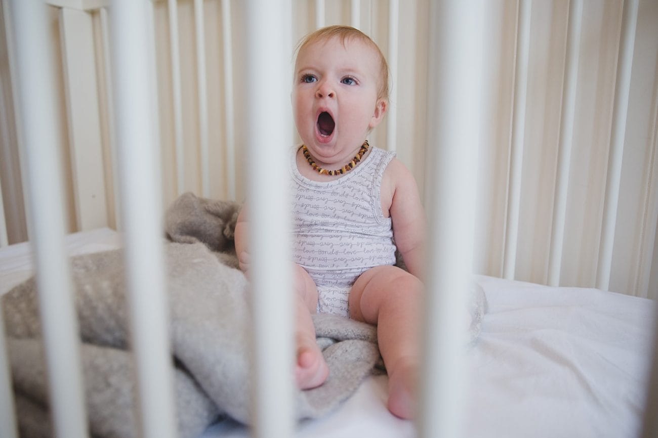 This documentary photograph of a baby yawning in her crib is one of the best family photographs of 2016