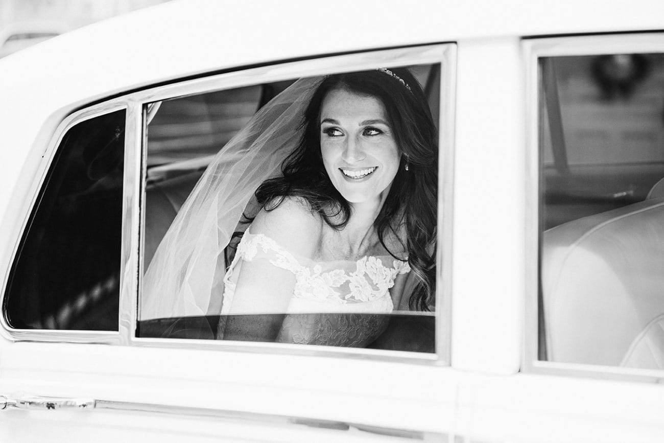 This documentary photograph of a bride arriving in her wedding car is one of the best wedding photographs of 2016