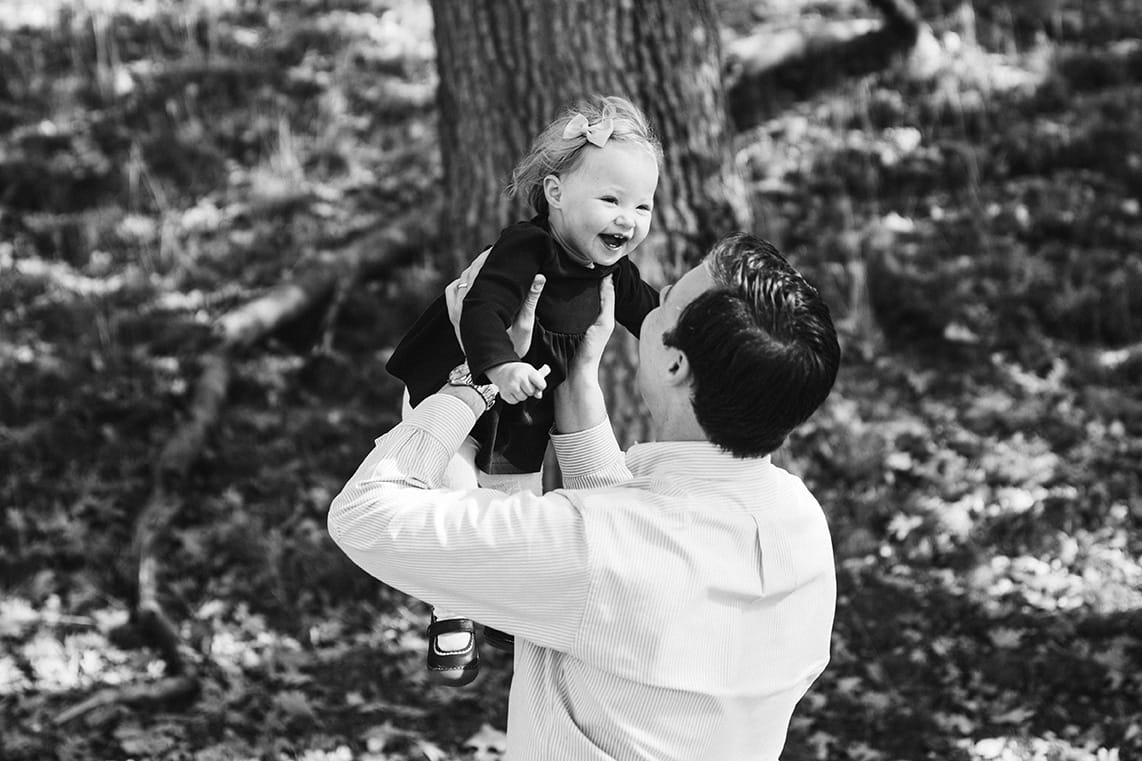 This lifestyle portrait of a father playing with his daughter is one of the best family photographs of 2016