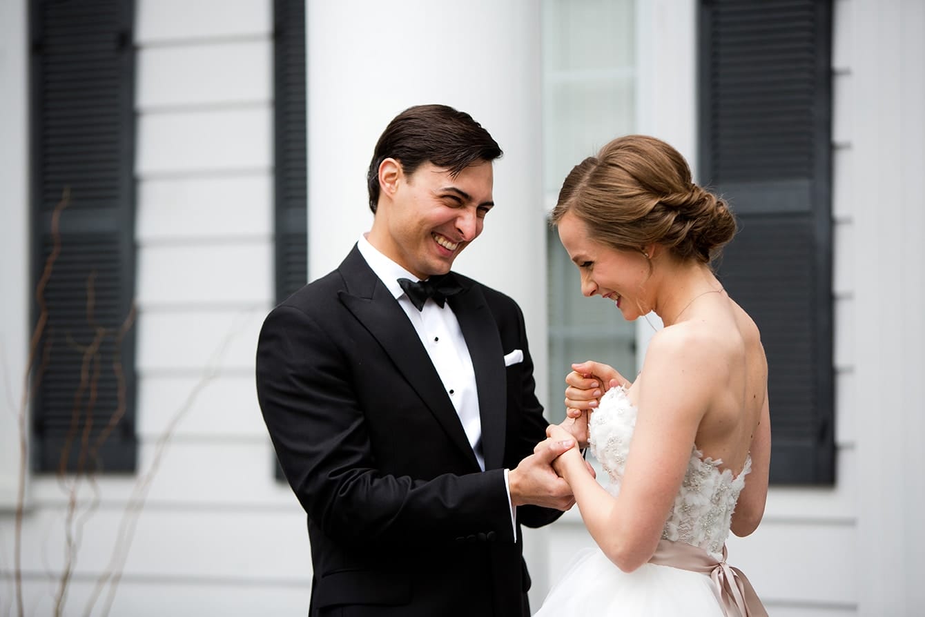 This documentary photograph of a bride and groom laughing together is one of the best wedding photographs of 2016