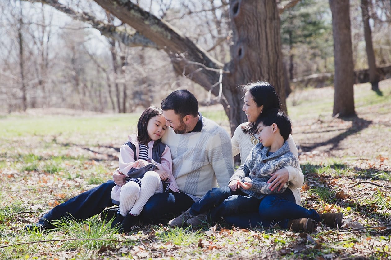 This lifestyle portrait of a family sitting together at the Arboretum is one of the best family photographs of 2016