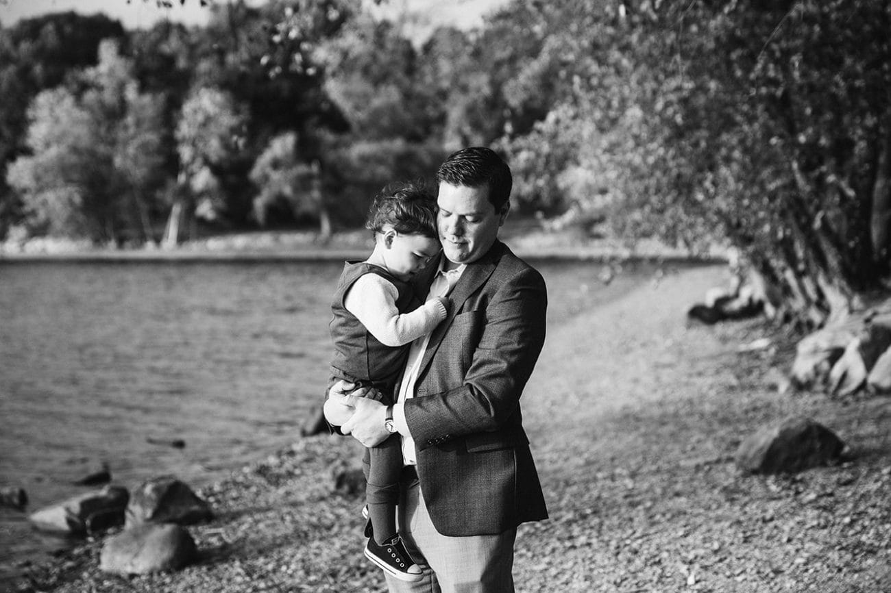 This lifestyle portrait of a father holding his son at Jamaica Pond is one of the best family photographs of 2016