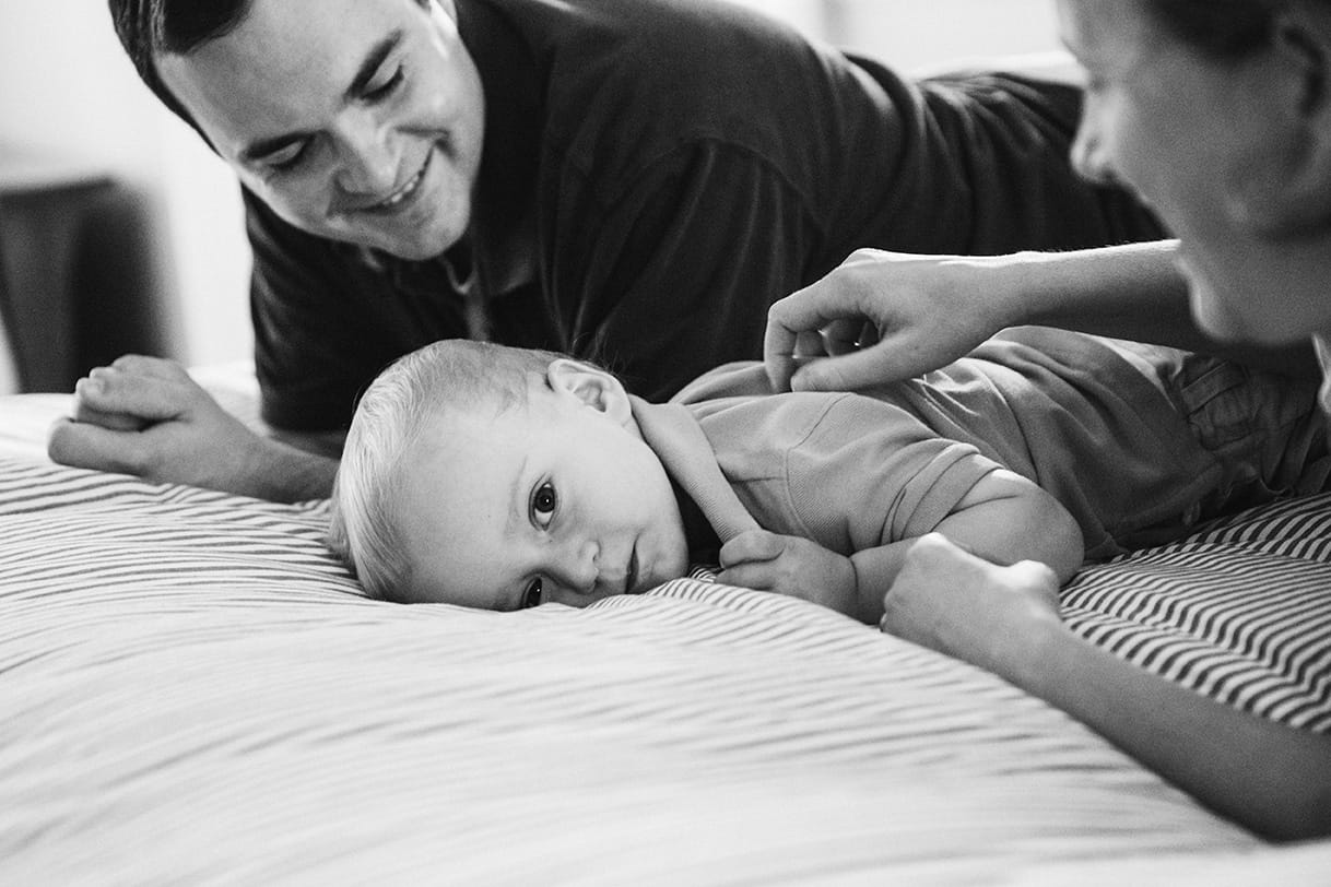This documentary photograph of a family playing on the bed is one of the best family photographs of 2016