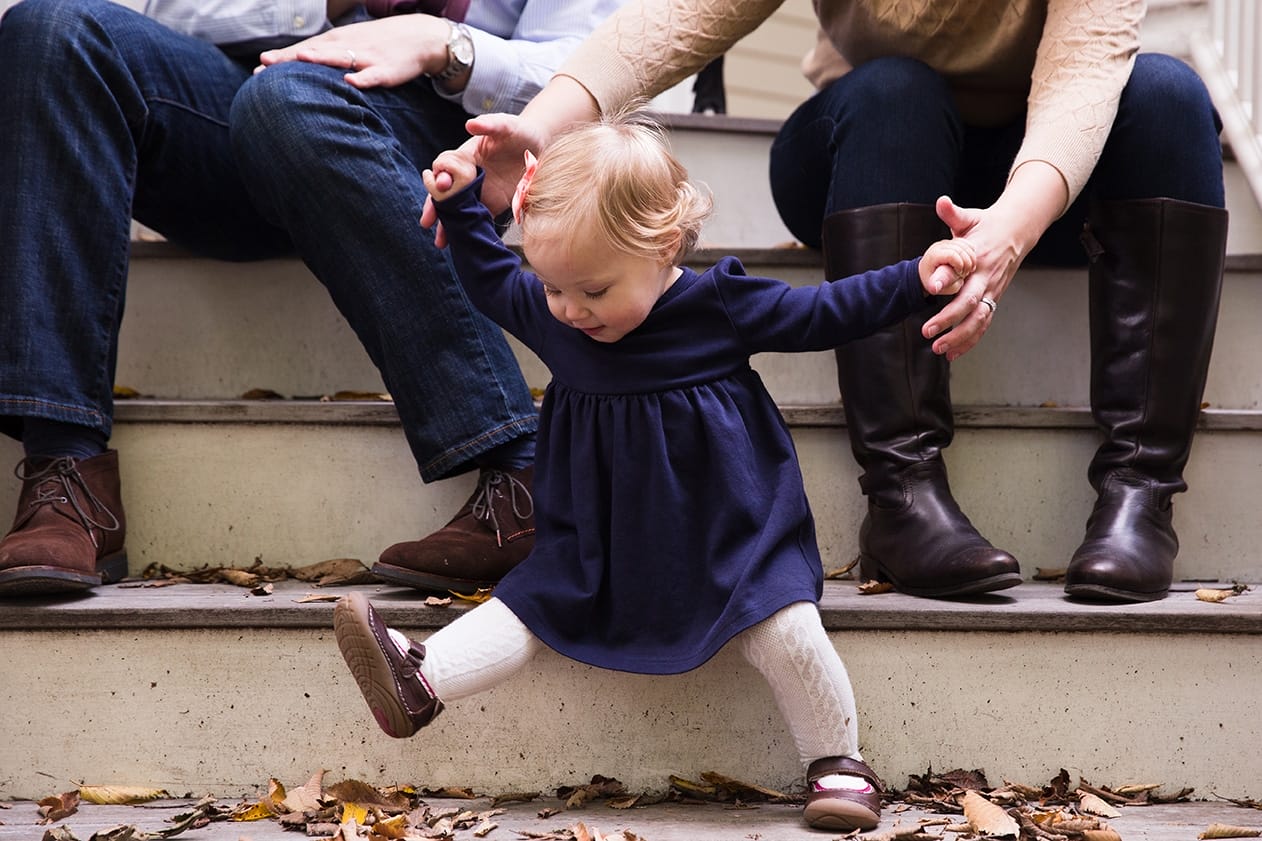 This documentary photograph of a mother helping her daughter on the steps is one of the best family photographs of 2016