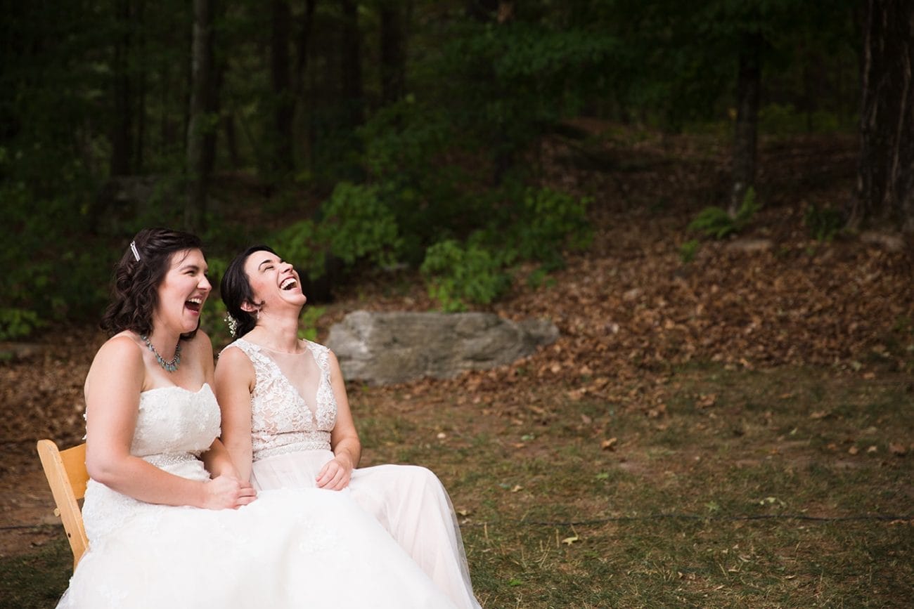 This documentary photograph of two brides laughing during their ceremony is one of the best wedding photographs of 2016