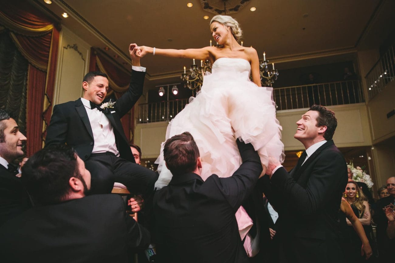 This documentary photograph of a bride and groom during the hora is one of the best wedding photographs of 2016