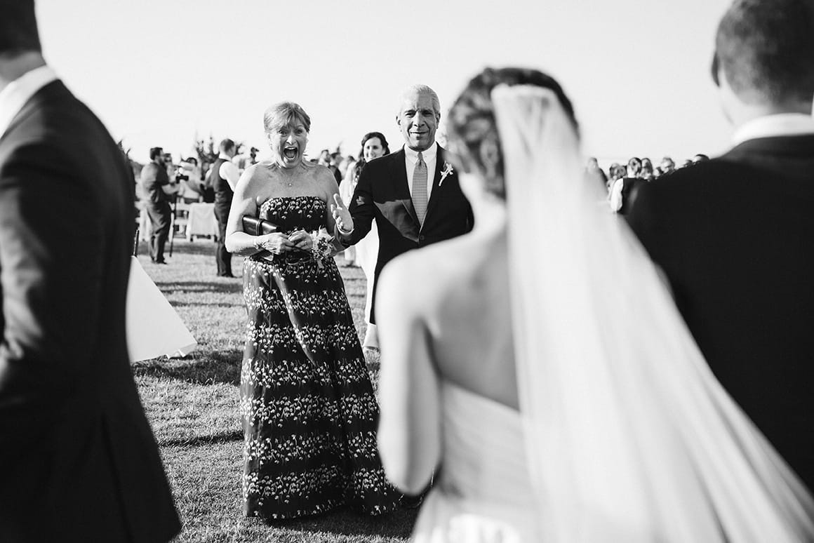 This documentary photograph of mother and father congratulating their bride is one of the best wedding photographs of 2016