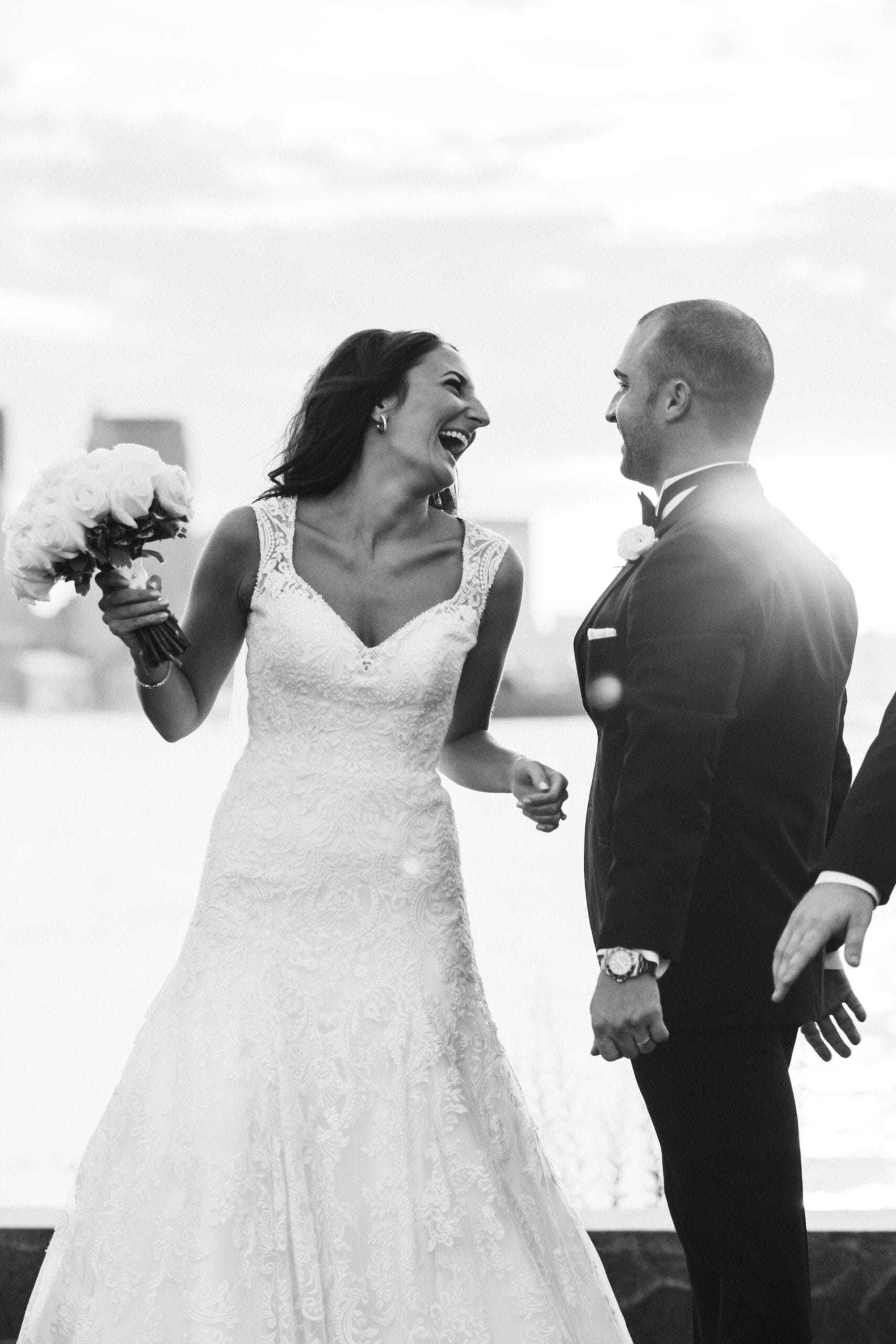 This documentary photograph of a bride and groom laughing together is one of the best wedding photographs of 2016