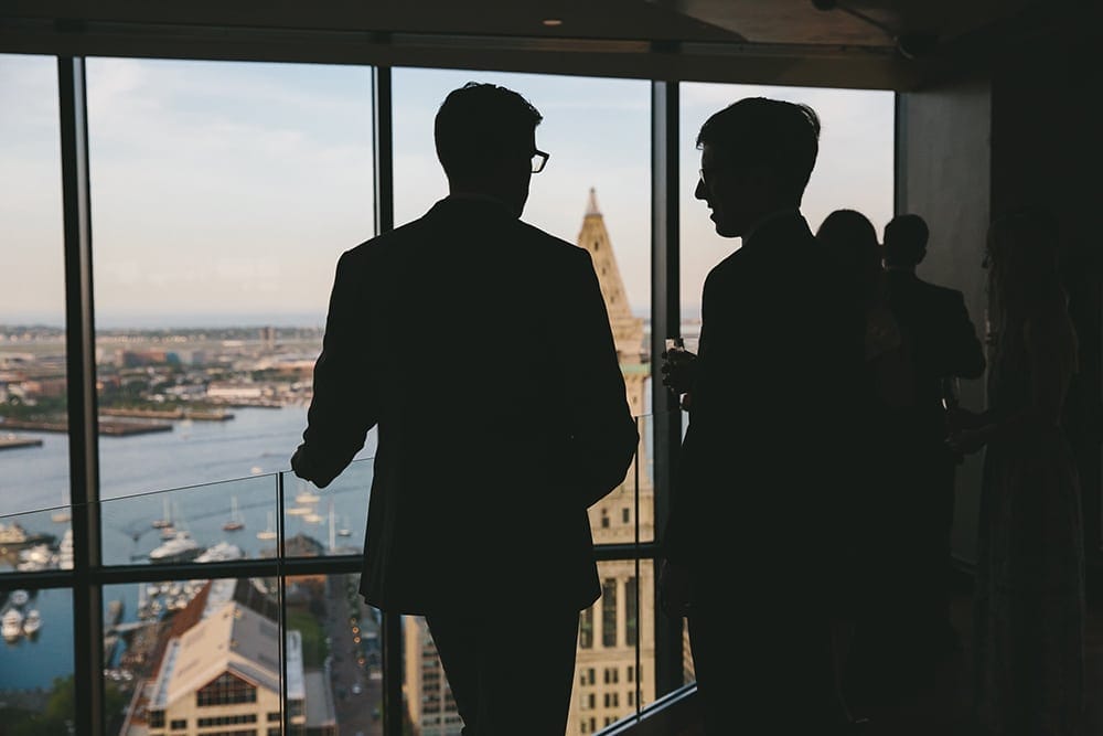 This documentary photograph of guests talking at a state room wedding is one of the best wedding photographs of 2016