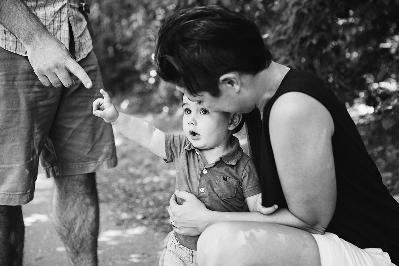 A documentary photograph of a family together during their Jamaica Pond family session in Boston, Massachusetts