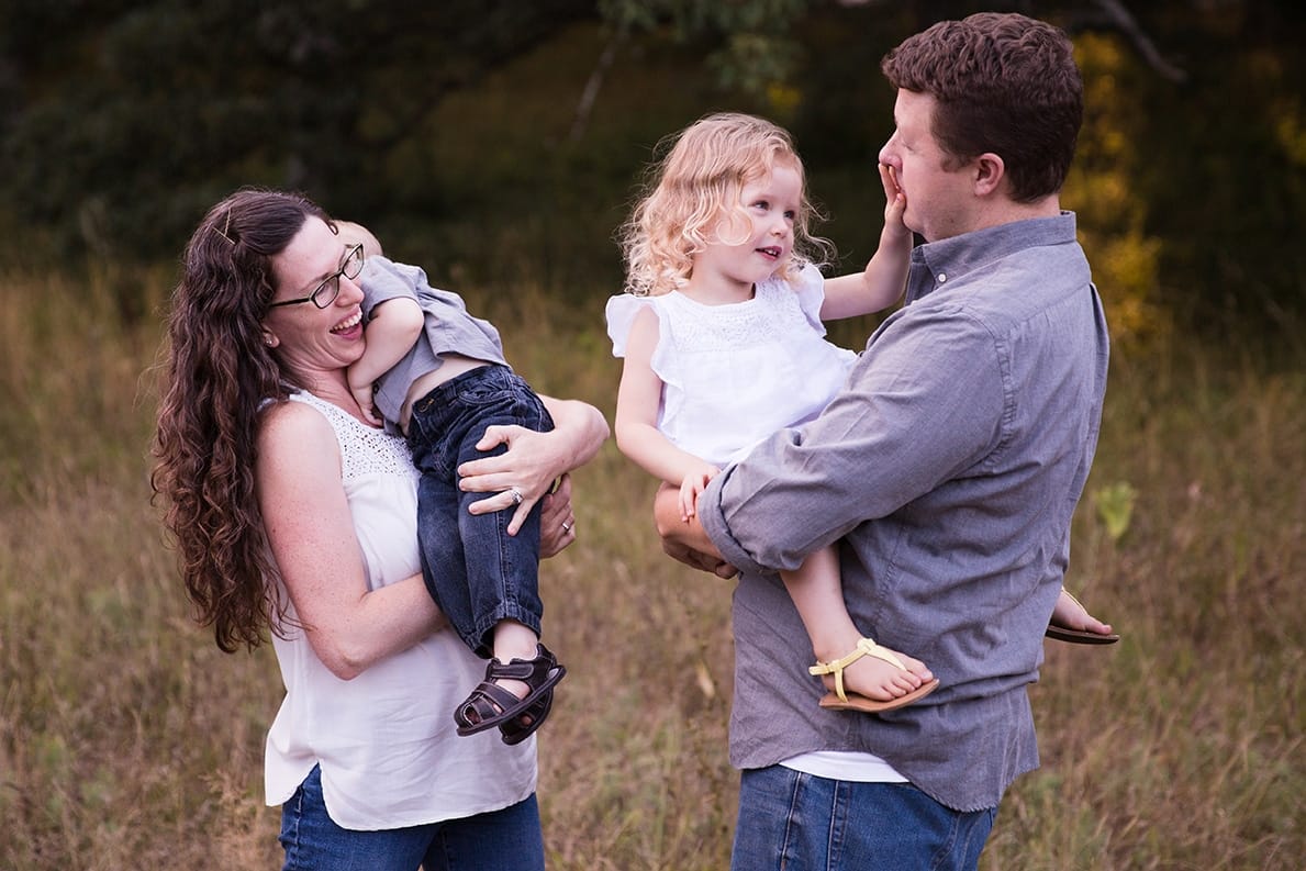 A documentary photograph of a family together during their Arnold Arboretum Family Session in Boston, Massachusetts