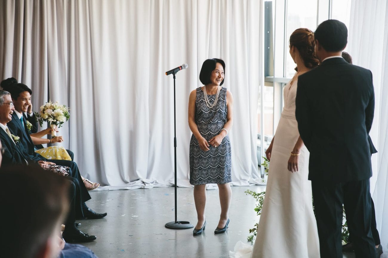 A documentary photograph of a mother giving a reading during an Artists for Humanity Wedding in Boston
