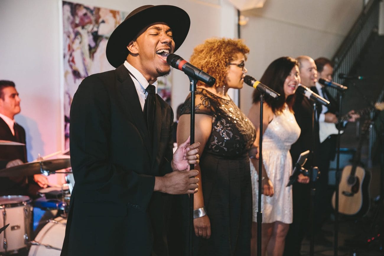 A documentary photograph of a band singing during an Artist for Humanity Wedding in Boston