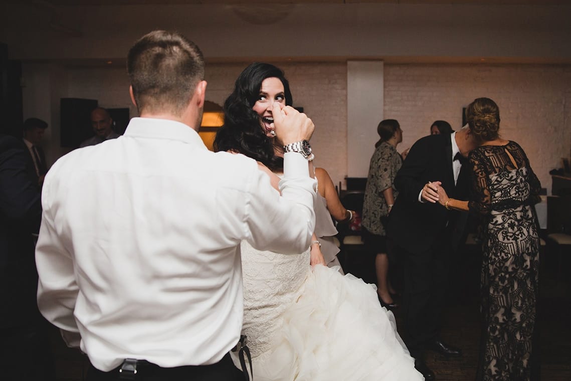 A documentary photograph of bride and groom dancing at their marliave wedding reception in Boston, Massachusetts