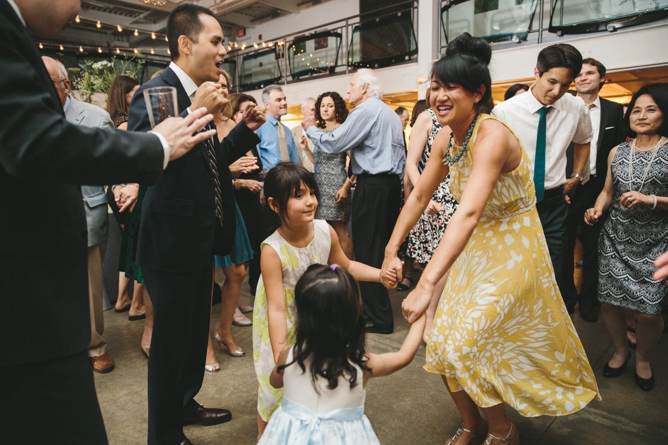 A documentary photograph of guests dancing at an Artists for Humanity Wedding in Boston