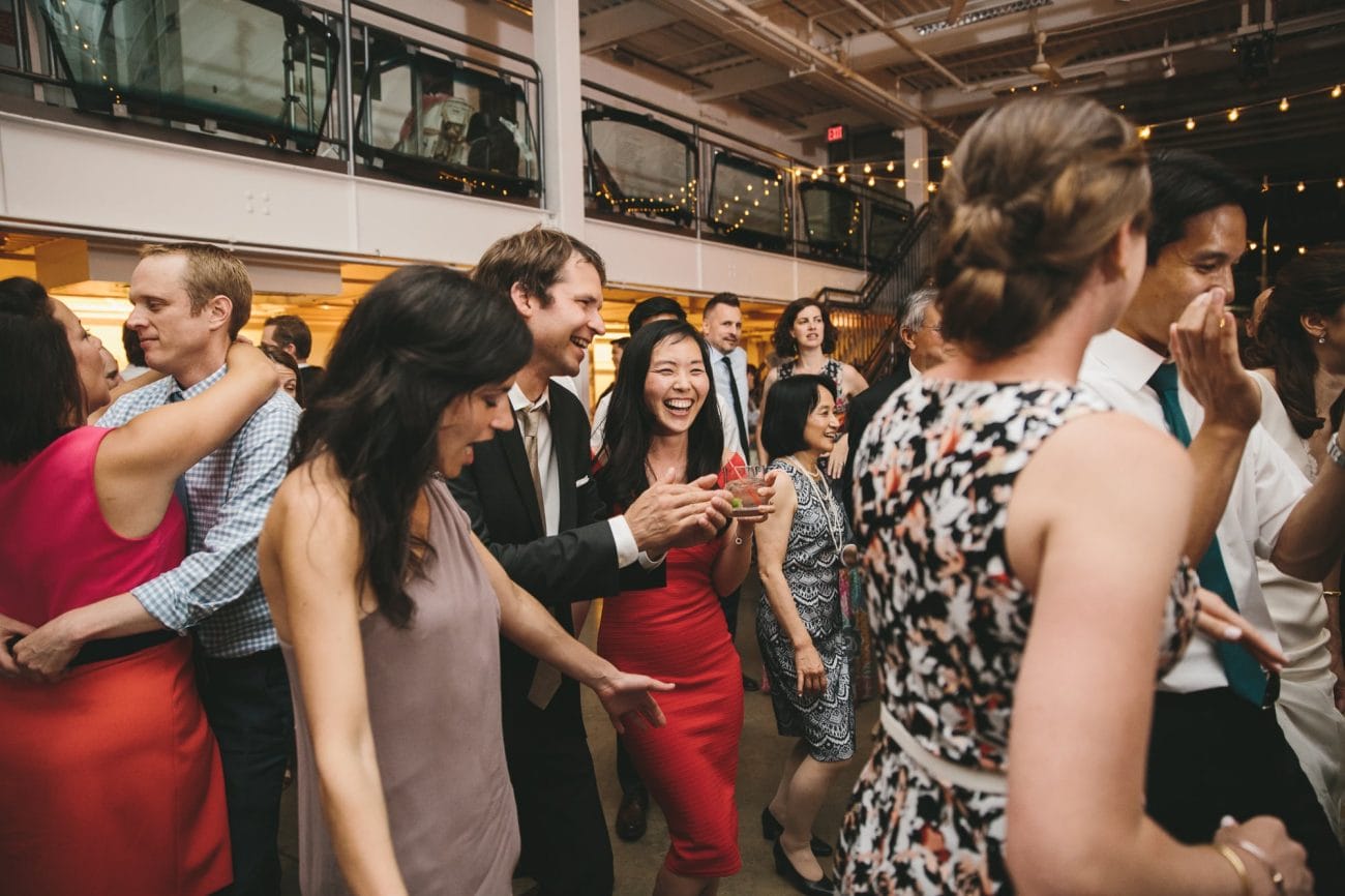A documentary photograph of guests dancing at an Artist for Humanity Wedding in Boston