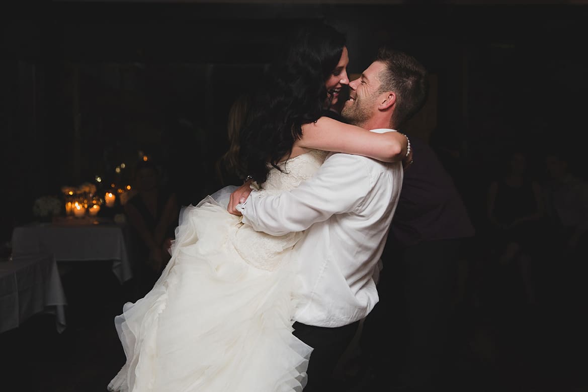 A documentary photograph of a bride and groom dancing during their old south meeting house wedding in Boston, Massachusetts