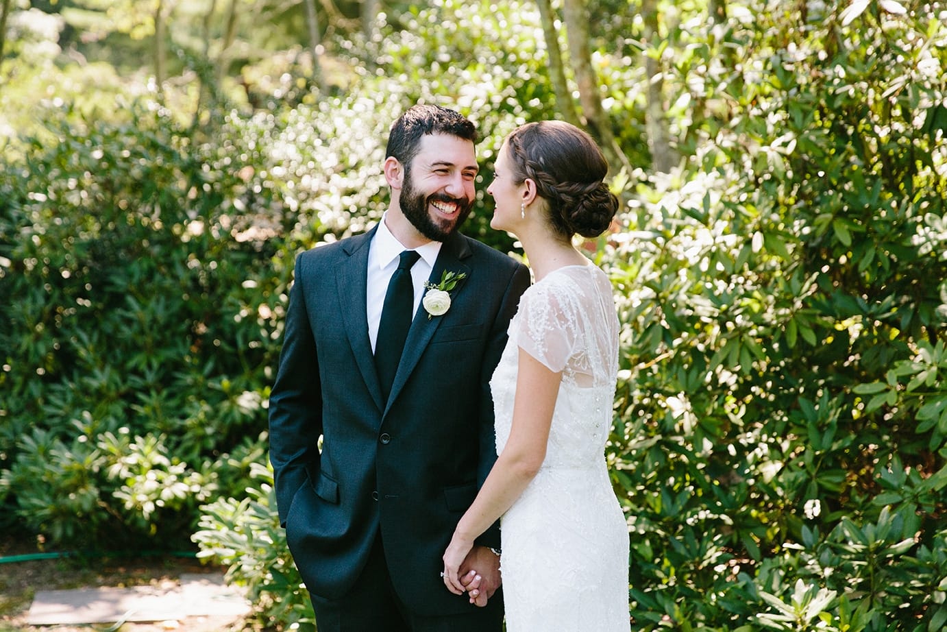 A documentary photograph of a bride and groom seeing each other before their Moraine Farm wedding in Beverly, Massachusetts