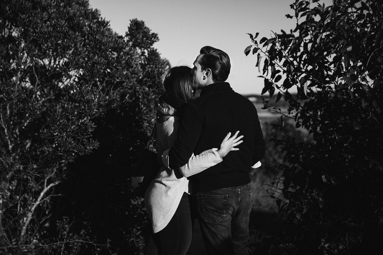 A documentary photograph of a couple hugging during their honeymoon photo session on Martha's Vineyard