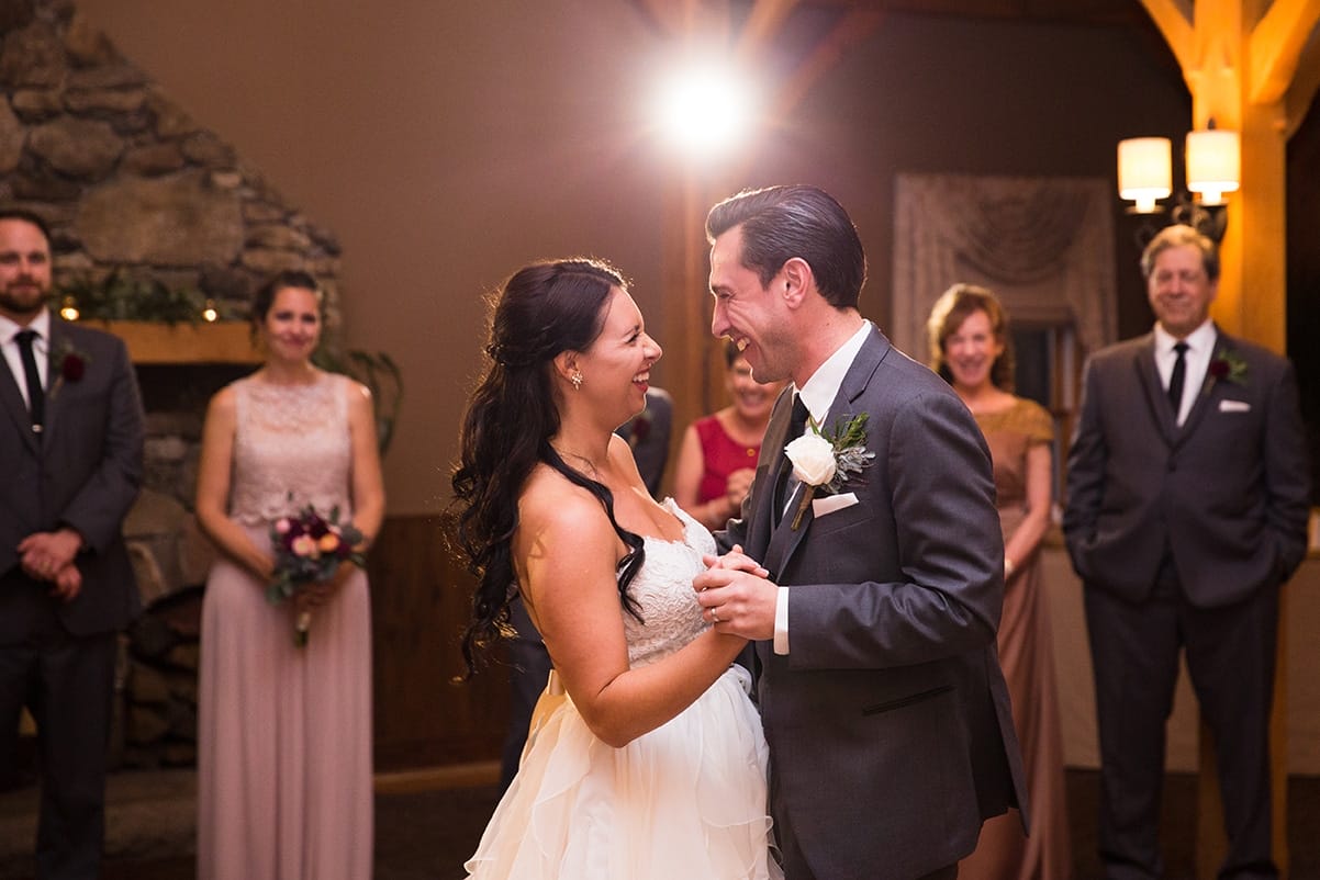 A documentary photograph of a bride and groom having their first dance during their Harrington Farm Wedding in Princeton, Massachusetts