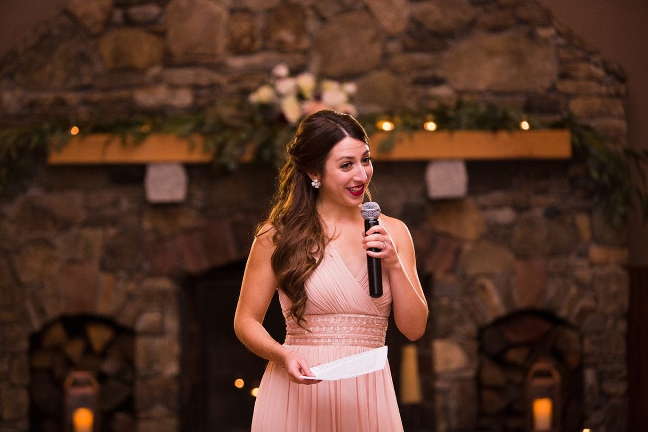 A documentary photograph of the maid of honor giving her speech at a Harrington Farm Wedding in Princeton, Massachusetts