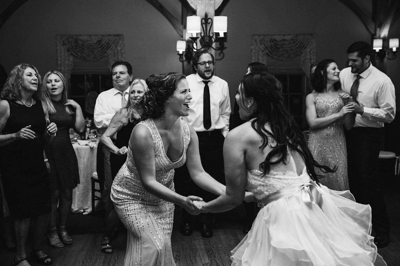 A documentary photograph of guests dancing during a Harrington Farm Wedding in Princeton, Massachusetts