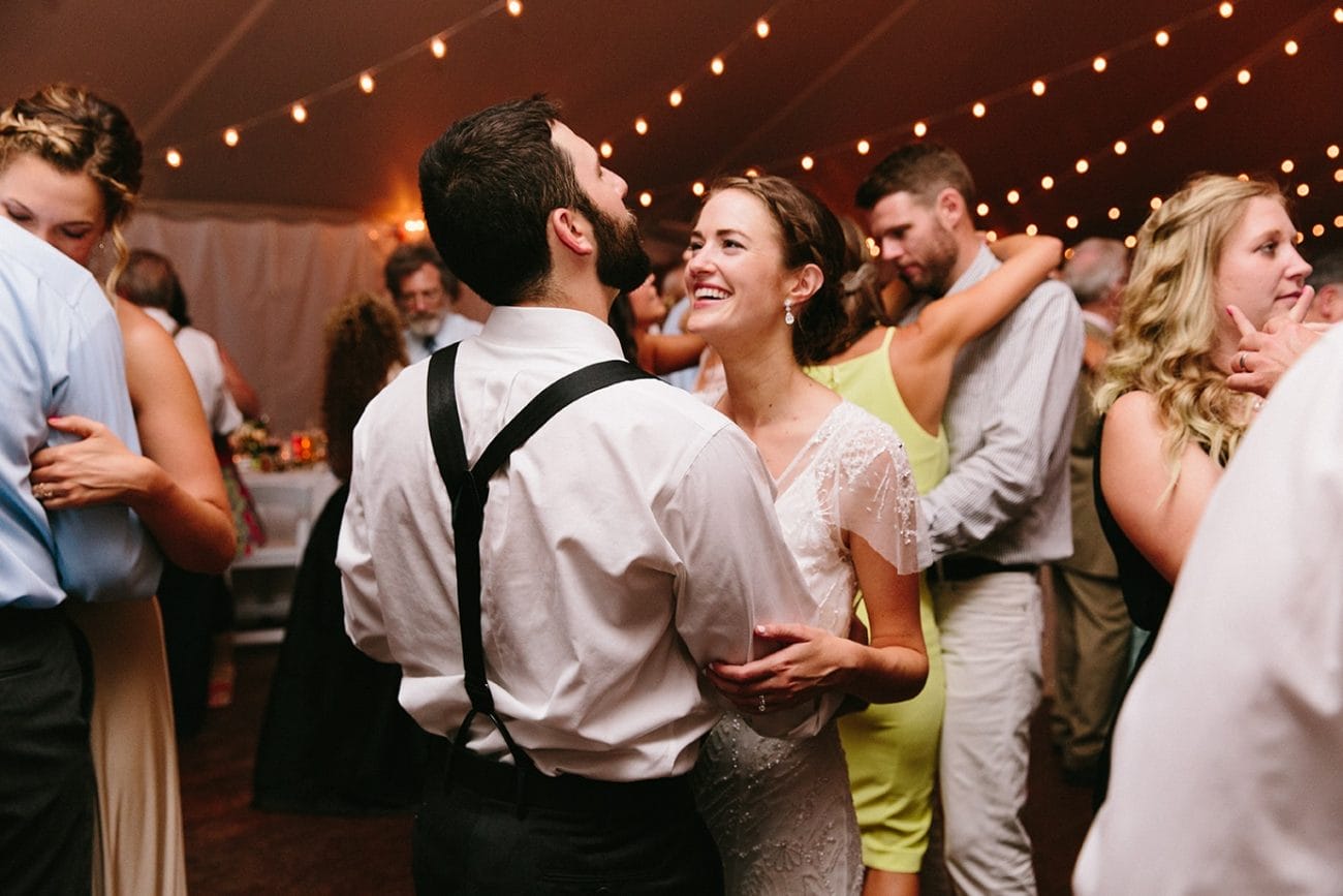 A documentary photograph of guests dancing during a Moraine Farm Wedding in Beverly, Massachusetts